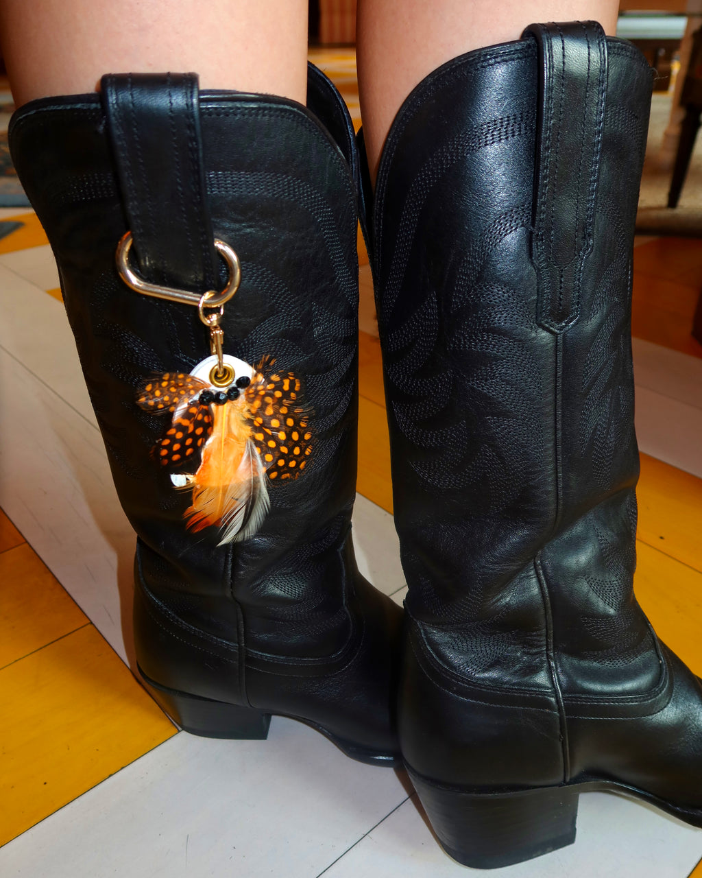 Feathered boot charms