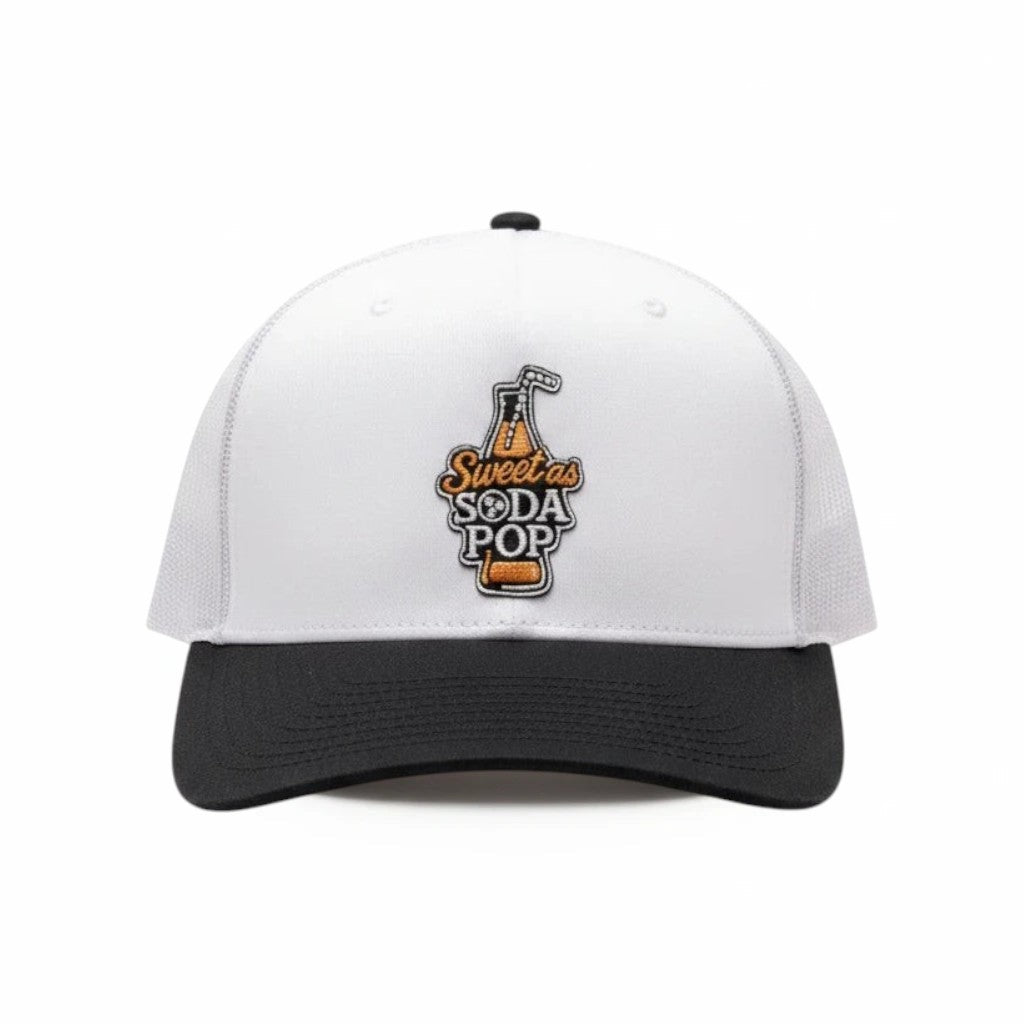 BOX SEAT Richardson 112 trucker hat in black and white with a Sweet as Soda Pop embroidered graphic on the front.