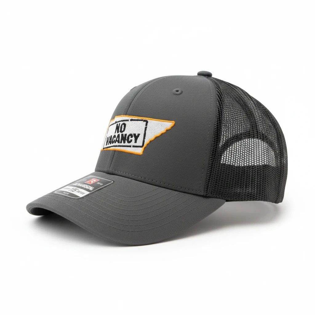 BOX SEAT charcoal and black Richardson 115 trucker hat with No Vacancy in Tennessee patch design