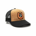 BOX SEAT Goodluck hat featuring a tan cork front panel, black mesh back, and a horseshoe patch with three stars.