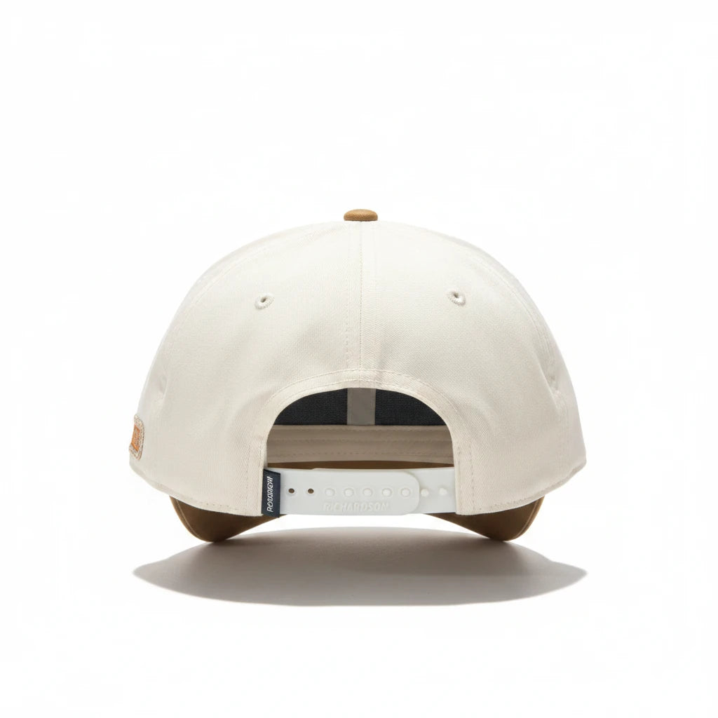 BOX SEAT Crush 'Em Richardson 312 hat in cream and tan with a white adjustable snapback closure, rear view.