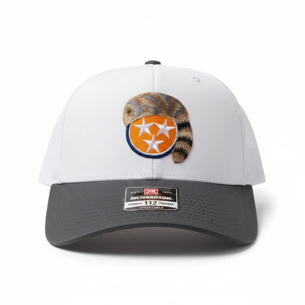 BOX SEAT Daniel Boone tri star Richardson 112 trucker hat with white front, grey brim, and raccoon tail embroidery