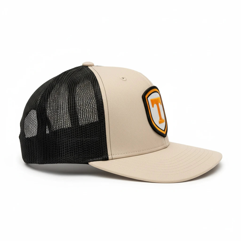 BOX SEAT Richardson 511 khaki and black trucker hat with a Power T shield patch on the front