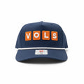 BOX SEAT navy blue snapback hat featuring orange VOLS block letter patches and a white rope detail on the brim