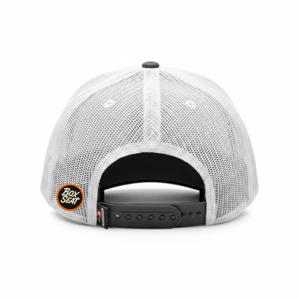 BOX SEAT Richardson 112 trucker hat back view featuring white mesh panels and an adjustable black snapback closure.