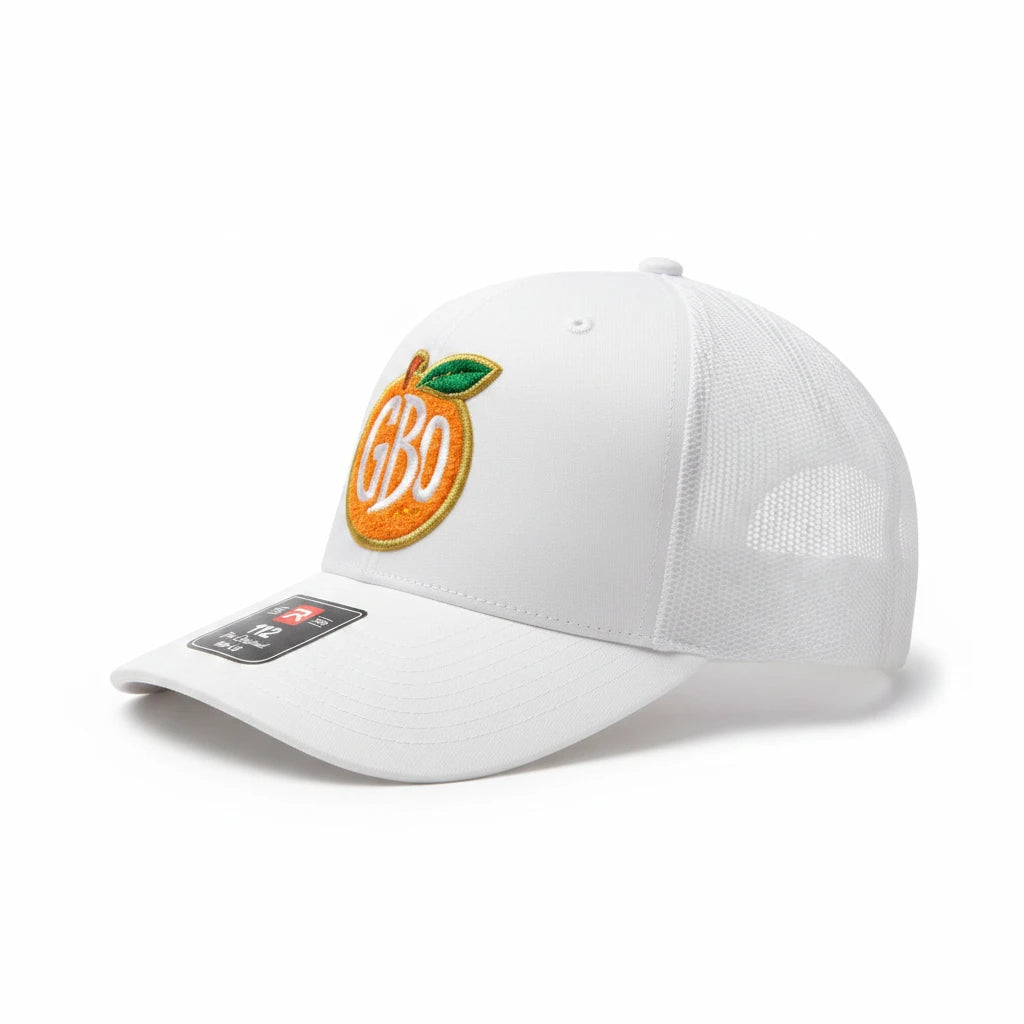 BOX SEAT white trucker hat featuring an embroidered orange fruit logo with GBO text on the front panel