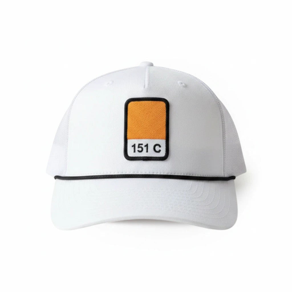 BOX SEAT white Richardson 112FPR trucker hat featuring an orange 151C Pantone patch and black rope trim detail