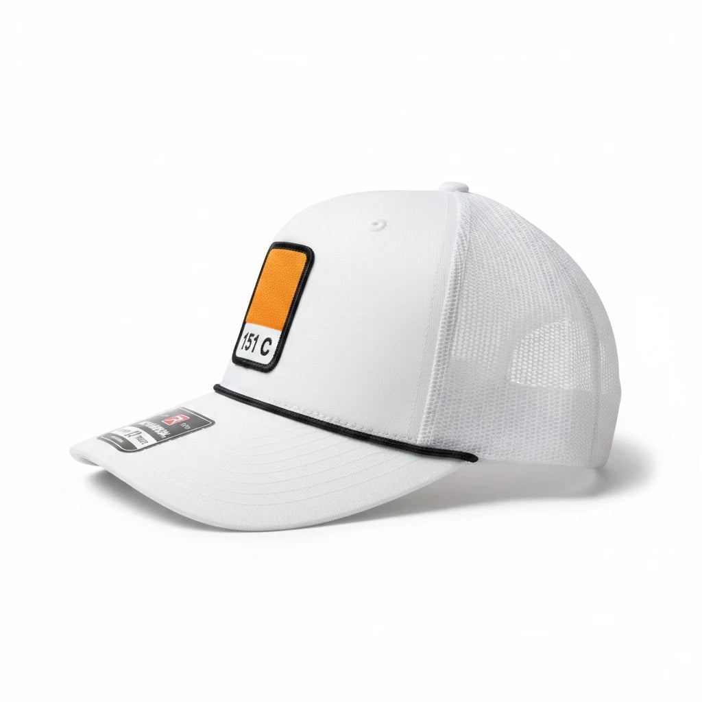 BOX SEAT white Richardson 112FPR trucker hat featuring a 151C Pantone orange square patch and black rope detail