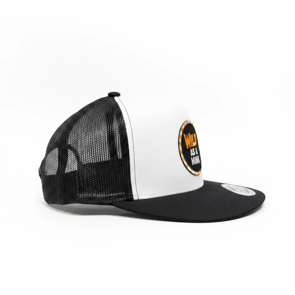 BOX SEAT Wild as a mink trucker hat in black and white with a circular graphic patch on the front